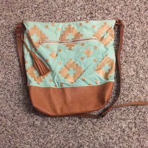 Harvest Crafts Handmade brown leather and sea foam bag painted copper design.